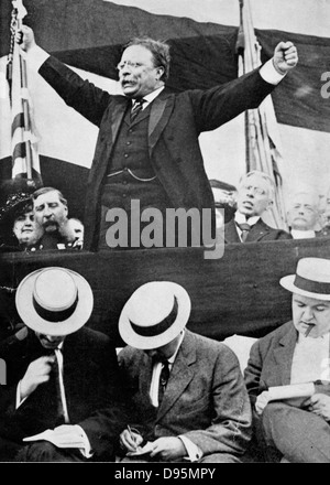 Theodore Roosevelt (1858-1919) President of USA 1901-1912 making a speech. In foreground, reporters are making notes. Stock Photo