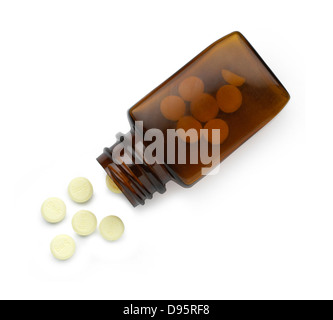 pot with white pills cut out onto a white background Stock Photo
