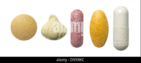 row of vitamins cut out onto a white background Stock Photo