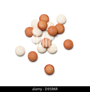vitamin tablets cut out onto a white background Stock Photo