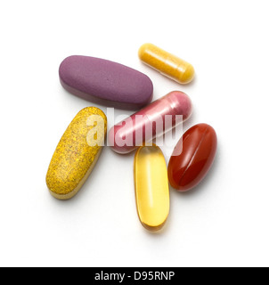 mixed pills and tablets cut out onto a white background Stock Photo