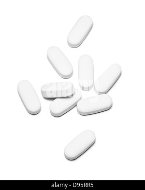 white pills cut out onto white background Stock Photo