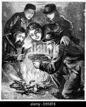 Miners in the Californian gold fields inspecting the result of their digging by the light of the camp fire.  Wood engraving London c1880. Stock Photo