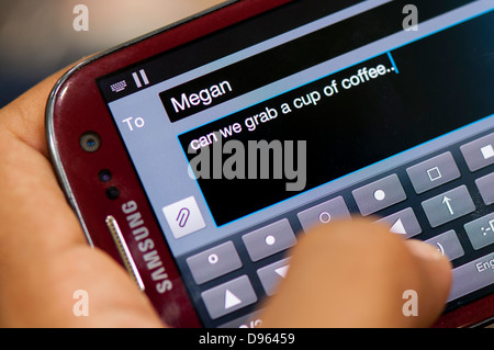 Texting using smartphone, close up Stock Photo