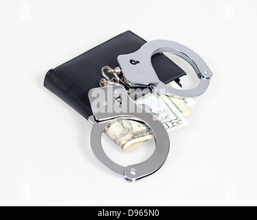 Dollars and handcuffs Stock Photo