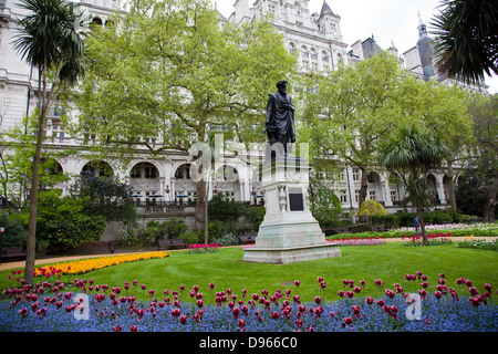 Whitehall Gardens on Victoria Embankment with William Tyndale Statue - London UK Stock Photo