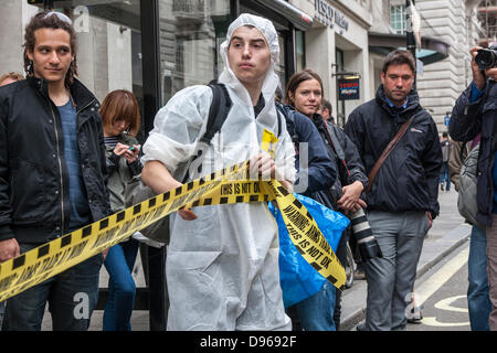 London, UK. 12th June 2013. Anarchists protest in London ahead of the G8 Summit to be held in Northern Ireland. Credit:  Paul Davey/Alamy Live News Stock Photo