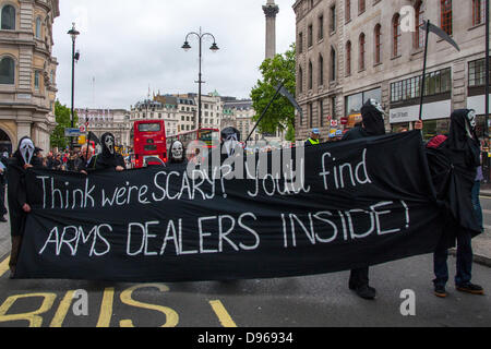 London, UK. 12th June 2013. Anti-arms trade anarchists march in London ahead of the G8 Summit to be held in Northern Ireland. Credit:  Paul Davey/Alamy Live News Stock Photo