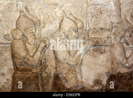 Assyrian wall-panel depicting an attack on an enemy town. Dated ...