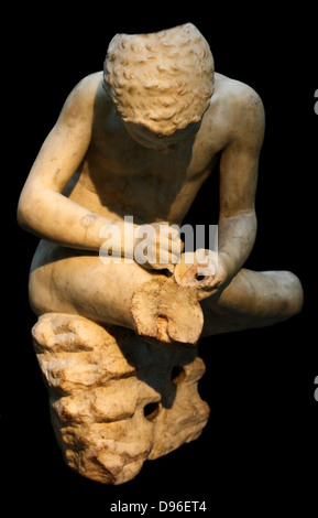 Marble statue of a boy, also known as the 'spinario', or thorn-puller. circa 25-50 AD, Roman copy of a lost Hellenistic work from 3rd century BC. Stock Photo