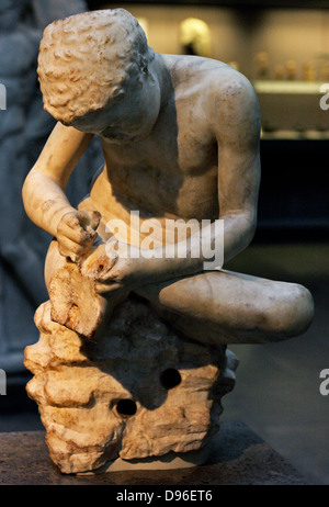 Marble statue of a boy, also known as the 'spinario', or thorn-puller. circa 25-50 AD, Roman copy of a lost Hellenistic work from 3rd century BC. Stock Photo