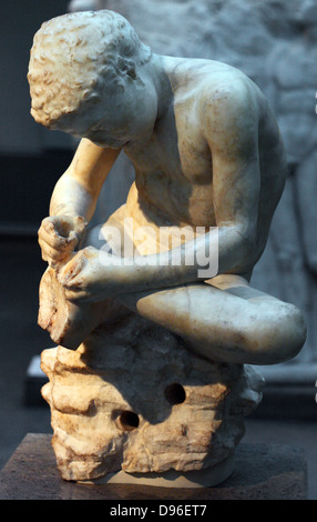 Marble statue of a boy, also known as the 'spinario', or thorn-puller. circa 25-50 AD, Roman copy of a lost Hellenistic work from 3rd century BC. Stock Photo