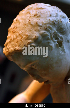 Detail from marble statue of a boy, also known as the 'spinario', or thorn-puller. circa 25-50 AD, Roman copy of a lost Hellenistic work from 3rd century BC. Stock Photo