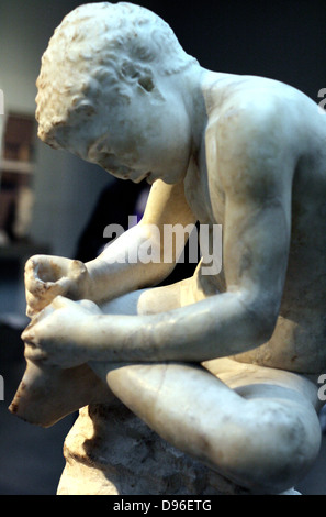 Marble statue of a boy, also known as the 'spinario', or thorn-puller. circa 25-50 AD, Roman copy of a lost Hellenistic work from 3rd century BC. Stock Photo