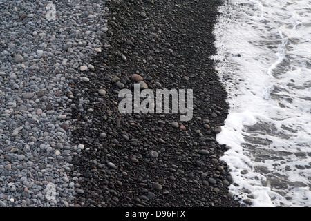 The volcanic beach on the French island of Reunion in the Indian Ocean. Stock Photo