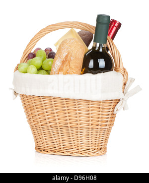 Picnic basket with bread, cheese, grape and wine bottles. Isolated on white background Stock Photo