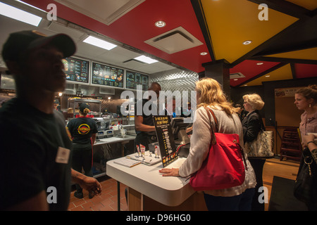 Burger lovers from far and wide descend on the new Fatburger restaurant in the Murray Hill neighborhood of New York Stock Photo