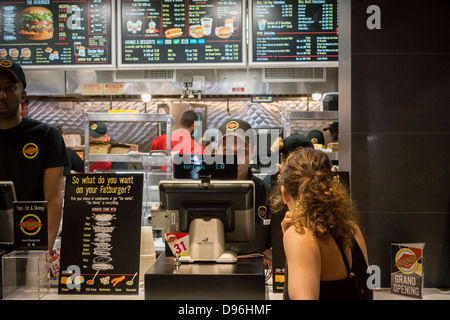 Burger lovers from far and wide descend on the new Fatburger restaurant in the Murray Hill neighborhood of New York Stock Photo