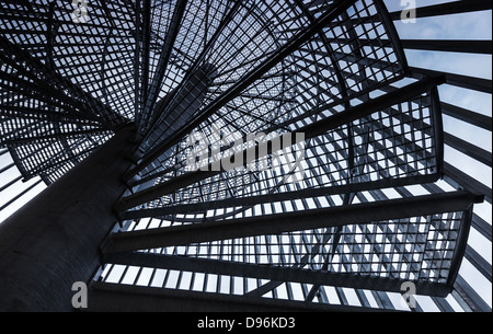 Metal modern spiral staircase details with blue sky one background Stock Photo