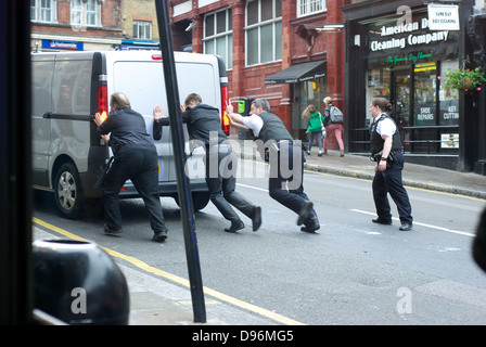 Police Help Broken Down Van Driver As They Push The Van To