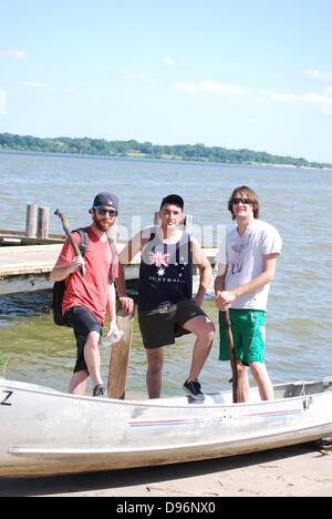 Three Men and A Lost Canoe Stock Photo