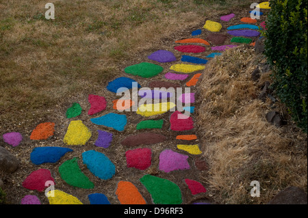 Rock path through yard with rocks multicolored Stock Photo