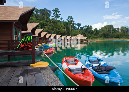 High end FLOATING BUNGALOS on CHIEW LAN RESERVOIR which was created by the Ratchaprapa dam in the heart of KHAO SOK NATIONAL PAR Stock Photo