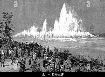 Blowing up Flood Rock, part of the Hell Gate Rocks complex which prevented large vessels reaching New York Harbour, and presented a hazard to smaller ones. Dynamite was the explosive used. From 'The Illustrated London News', October 1885. Wood engraving. Stock Photo