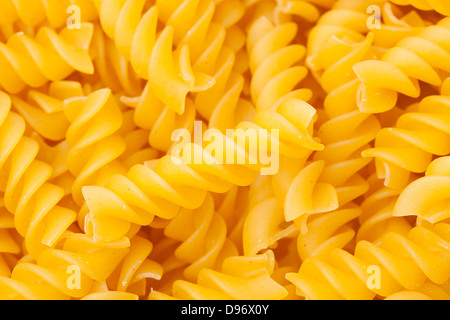 Uncooked dry Italian rotini pasta Stock Photo