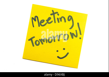 Sticky note with text 'Meeting Tomorrow' Stock Photo