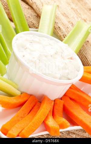 Celery and carrot sticks with ranch, healthy snack idea Stock Photo - Alamy
