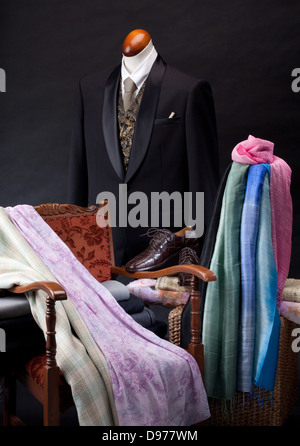 Detail of a clothing mannequin in a men suit shop with a white