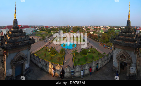 Horizontal panoramic (3 picture stitch) view from the Victory Gate or Patuxai in central Vientiane on a sunny evening. Stock Photo