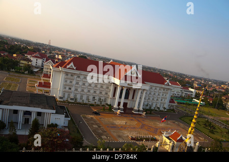 Horizontal view of the Prime Minister's Office and Government buildings from the Victory Gate or Patuxai in central Vientiane. Stock Photo