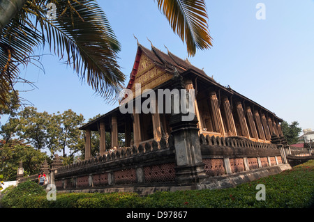 Horizontal exterior view of Wat Ho Phra Keo, or the Temple of the Emerald Buddha in Vientiane on a sunny day. Stock Photo