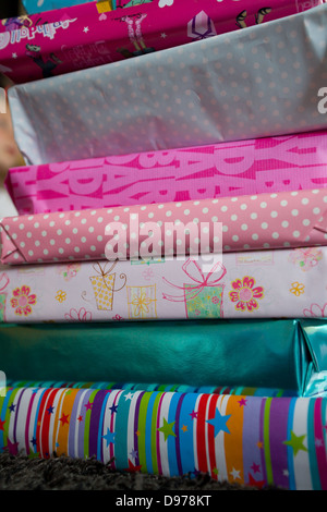 A pile of wrapped girls birthday presents Stock Photo