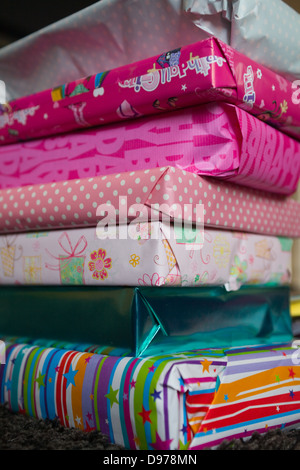 A pile of wrapped girl's birthday presents Stock Photo