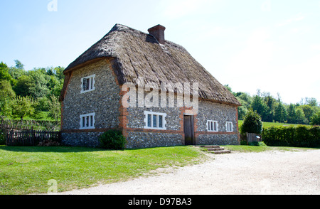 17th Century 2 floor house from Walderton, Sussex with thatched roof on a summer's day Stock Photo