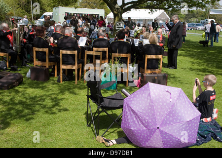 People watching a brass band perform during a country fair, Helmingham ...