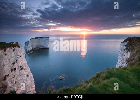 Sunrise over Old Harry Rocks, Jurassic Coast, Dorset, England. Spring (April) 2012. Stock Photo