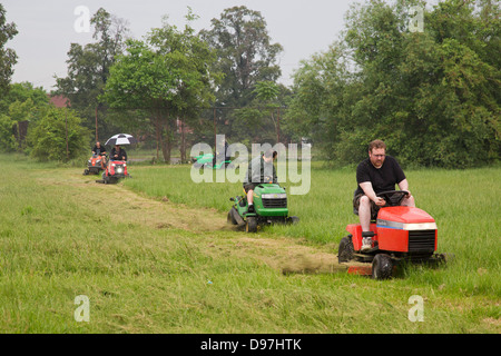 The Detroit Mower Gang, an informal group of volunteers, cuts the grass in parks that the city can no longer afford to maintain. Stock Photo