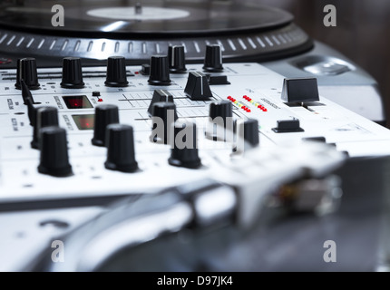 Professional sound equipment for a disc jockey. Turntable vinyl record players and 2 channel sound mixing controller.  Stock Photo