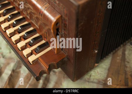 Closeup of antique carved accordion. Stock Photo