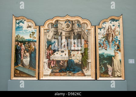 BRUSSELS, Belgium - A 16th century triptych titled Triptyque de L'Abbaye de Dielegem possibly by artist Jan Van Dornicke on display at the Royal Museums of Fine Arts in Belgium (in French, Musées royaux des Beaux-Arts de Belgique), one of the most famous museums in Belgium. The complex consists of several museums, including Ancient Art Museum (XV - XVII century), the Modern Art Museum (XIX  XX century), the Wiertz Museum, the Meunier Museum and the Museé Magritte Museum. Stock Photo