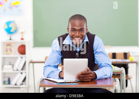 handsome elementary school teacher using a tablet computer Stock Photo