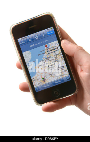 Woman hand holding iPhone showing navigation on google maps Stock Photo