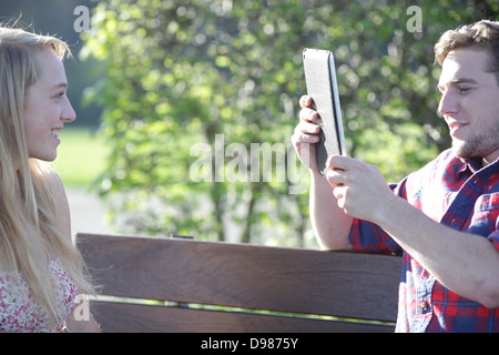 a young couple looking at a tablet pc Stock Photo