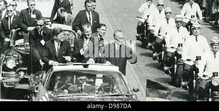 John F Kennedy (1917-1963) President of the USA, Willy Brandt (1913-1992) and Konrad Adenauer (1876-1967) Chancellor of West Germany travelling in Berlin in an open car and acknowledging cheers from the crowd during the President's visit to the Federal German Republic, 26 June 1963. Stock Photo