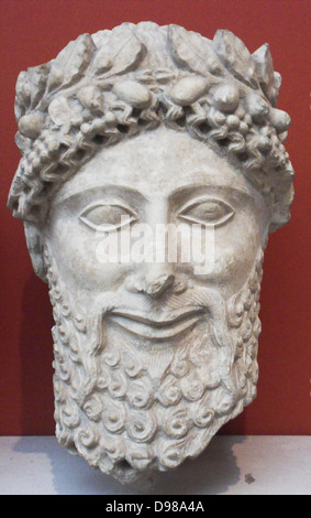 Limestone head of a statue of a bearded worshipper.  Made in Cyprus 475-450 BC.  From the sanctuary of Apollo at Idalion.  He wears a laurel wreath with beads or acorns.  His hair has a fringe of spiral curls and is combed into tresses on the crown which fall down the neck. Stock Photo
