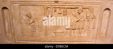 Funerary relief for butcher, AD125-150.  A butcher is at work in his shop; various cuts of meat hang above; his seated wife holds a wax tablet; she goes the shop's accounts.  She wears a fashionable hairstyle of the Hadrianic period.  The relief was probably set in the facade of a tomb. Stock Photo